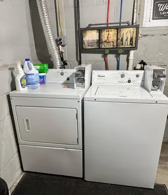 two white appliances are sitting next to each other at Private Cozy Apartment - Only 5 min Away from Newark Airport and 30 min to NYC in Elizabeth