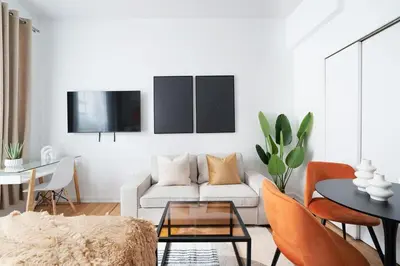 a living room with a couch and a table at 74-3C New Studio in Prime UWS - GYM In Building in New York