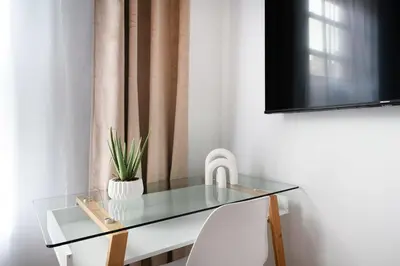 a glass table with a faucet and a sink at 74-3C New Studio in Prime UWS - GYM In Building in New York