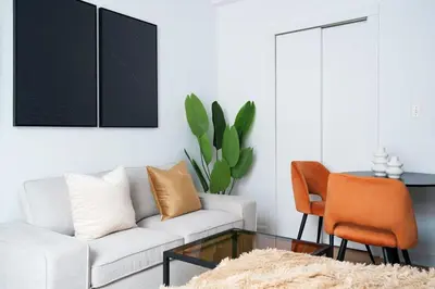 a living room with a couch and a table at 74-3C New Studio in Prime UWS - GYM In Building in New York