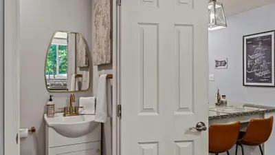 a bathroom with a sink and a mirror at Slopeside Escape by AvantStay Walk to Ski Lifts Arcade Games Shuffleboard in Tannersville