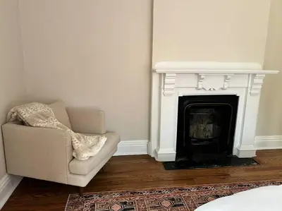 a living room with a couch and a fireplace at 7BR Spacious Property Perfect For up to 15! in Orange