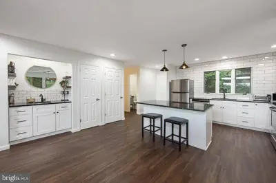 a large kitchen with white cabinets and a counter at Pocono Mountains Village at Camelback 284 Overlook Way in Tannersville