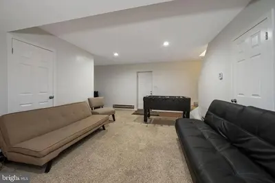 a living room with a couch and a piano at Pocono Mountains Village at Camelback 284 Overlook Way in Tannersville