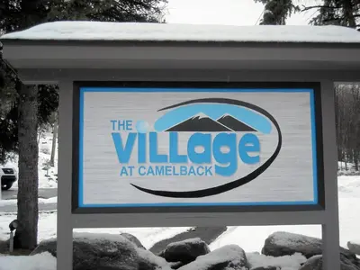 a sign for the village at canadian back at Pocono Mountains Village at Camelback 284 Overlook Way in Tannersville
