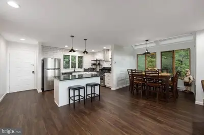 a kitchen and dining room with a table and chairs at Pocono Mountains Village at Camelback 284 Overlook Way in Tannersville