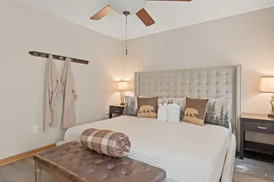 a bedroom with a large bed with a large headboard at Love Lace Retreat in Albrightsville