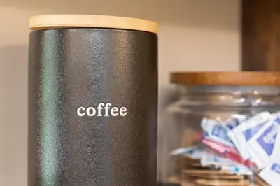 a black thermos with the word coffee on it at Love Lace Retreat in Albrightsville