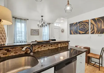 a kitchen with a sink and a counter top at 2 Miles From Rocky Statue in Philadelphia