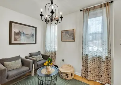 a living room with a couch and a table at 2 Miles From Rocky Statue in Philadelphia