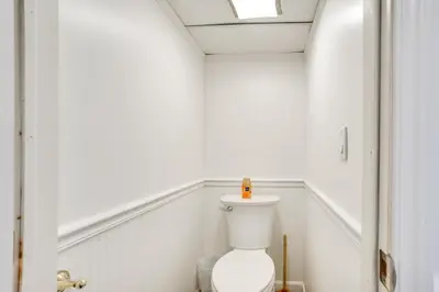 a bathroom with a white toilet in a room at Shared Yard, 4 Mi to NYC Englewood Apartment! in Englewood