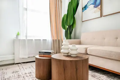 a living room with a couch and a table at 73-1406 New 1BR 1Bth UWS Doorman Gym in New York