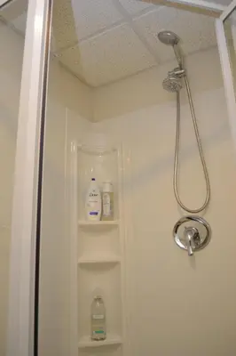 a shower in a bathroom with two bottles of soap at Spacious 2BD near Princeton, Cafes! Family, Backyard, Parking