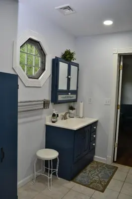 a bathroom with a sink and a mirror and a stool at Spacious 2BD near Princeton, Cafes! Family, Backyard, Parking