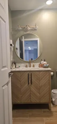 a bathroom with a sink and a mirror at Sparta lakehouse in Sparta