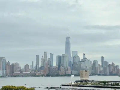 a view of a city skyline with the oriental pearl tower at Luxury 2BR - Elevator-Gym-Laundry-10 Min to NYC in Hoboken