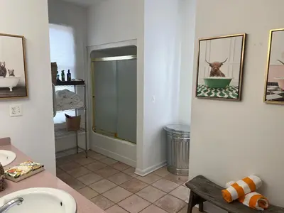 a bathroom with a sink and a mirror at THE VILLA Farm Sleeps 20 more in Montgomery