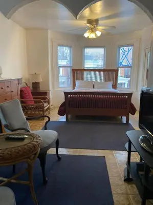 a living room with a bed and a couch at Black Oak Rest in Philadelphia