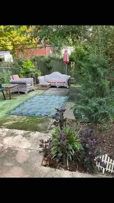 a backyard with a pool with a bench and a table at Black Oak Rest in Philadelphia