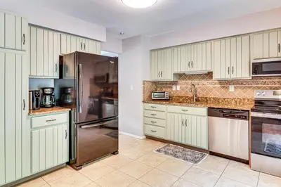 a kitchen with white cabinets and a stainless steel refrigerator at Family Home Close to Warwick, 5 Mi to Lake! in Monroe