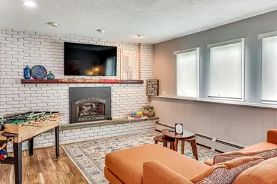 a living room with a fireplace and a tv at Family Home Close to Warwick, 5 Mi to Lake! in Monroe