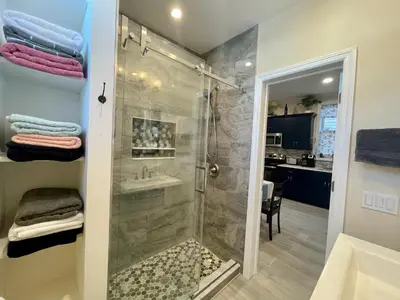 a bathroom with a shower and a sink at New York City Private Bedroom Near Free Ferry Boat! in Stapleton