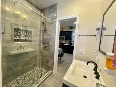 a bathroom with a shower and a sink at New York City Private Bedroom Near Free Ferry Boat! in Stapleton