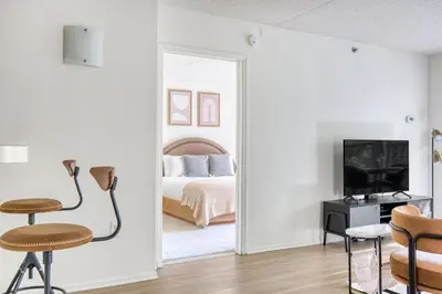 a bedroom with a bed and a mirror at Jersey City 2br w wd gym elevator nr path NYC-672 in New York