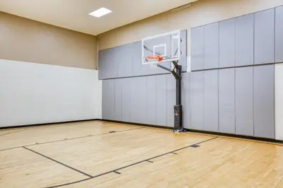 an empty gym with a basketball hoop at Jersey City 2br w wd gym elevator nr path NYC-672 in New York