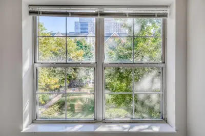 an open window with a view of a city at Jersey City 2br w wd gym elevator nr path NYC-672 in New York
