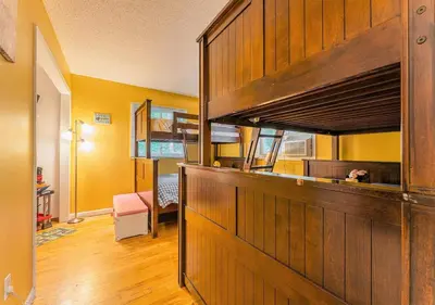 a room with a bunk bed in a house at Charming Lakefront Getaway with Hot Tub & Game Room Perfect for Families! in East Stroudsburg