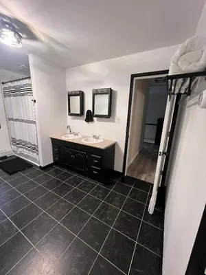 a bathroom with two sinks and a large mirror at Peaceful home in mount bethel, PA in Mount Bethel