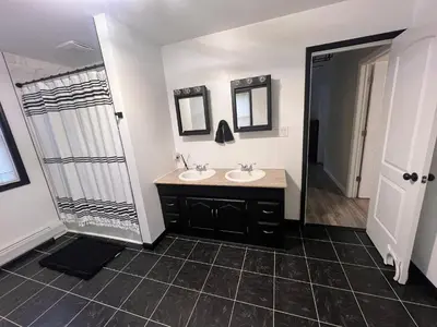 a bathroom with two sinks and a shower at Peaceful home in mount bethel, PA in Mount Bethel