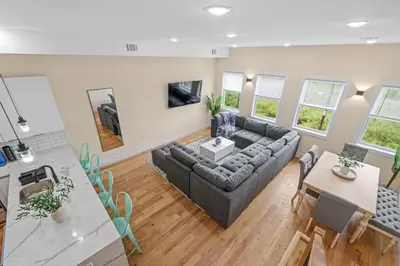 a living room with a couch and a table at Skyline Serenity Luxe NYC Retreat in Jersey City