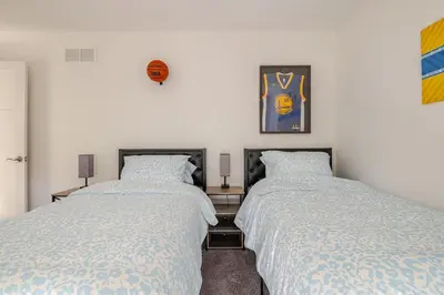 two beds sitting next to each other in a bedroom at Perfect Family Getaway! Steps from Attractions in Hummelstown
