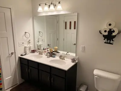 a bathroom with a sink and a mirror at Perfect Family Getaway! Steps from Attractions in Hummelstown