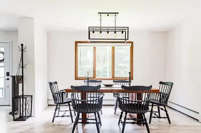a dining room with a table and chairs at Eldred Manor in Eldred
