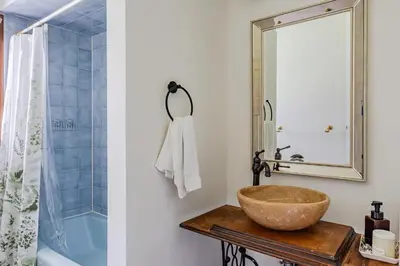 a bathroom with a bowl sink and a mirror at Eldred Manor in Eldred