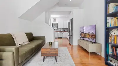 a living room with a couch and a coffee table at Modern Chic Fishtown-Philly Home with Roof Deck in Philadelphia