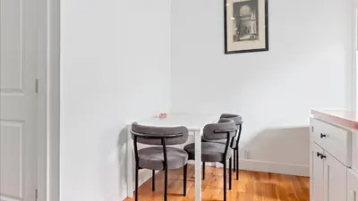 a white table with four chairs in a kitchen at Modern Chic Fishtown-Philly Home with Roof Deck in Philadelphia