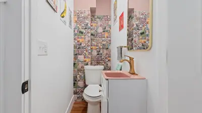 a bathroom with a toilet and a sink at Modern Chic Fishtown-Philly Home with Roof Deck in Philadelphia