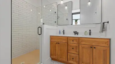 a white bathroom with a sink and a shower at Modern Chic Fishtown-Philly Home with Roof Deck in Philadelphia