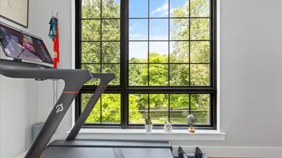 a room with a treadmill and a window at Modern Chic Fishtown-Philly Home with Roof Deck in Philadelphia