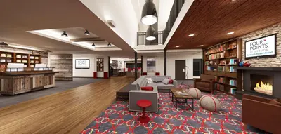 a living room with a couch and a fireplace at The Crossroads Hotel - Newburgh in Newburgh