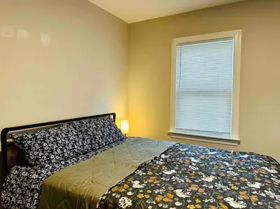 a bedroom with a bed and a window at Campu Whole House in Cherry Hill