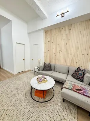 a living room with a couch and a table at GREAT APT 2 BED ROOM GREAT LOCATION nye in New York