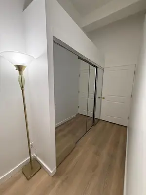 an empty room with a glass door and a lamp at GREAT APT 2 BED ROOM GREAT LOCATION nye in New York