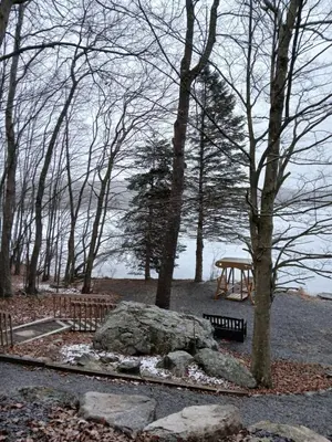 a park with a picnic table and a rock and trees at Mountain Lake Retreat in Clifton