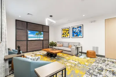 a living room with a couch and a table at Jersey City's Best Enjoy Our Deluxe 1 Bedroom Condo Only 25 Minutes to NYC in Jersey City