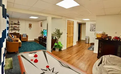 an office with a pool table in the middle of a room at WOW!! Ultimate Pocono Retreat Hot Tub, Game Room, Fire Pit, Near Lakes & Hiking! in Blakeslee